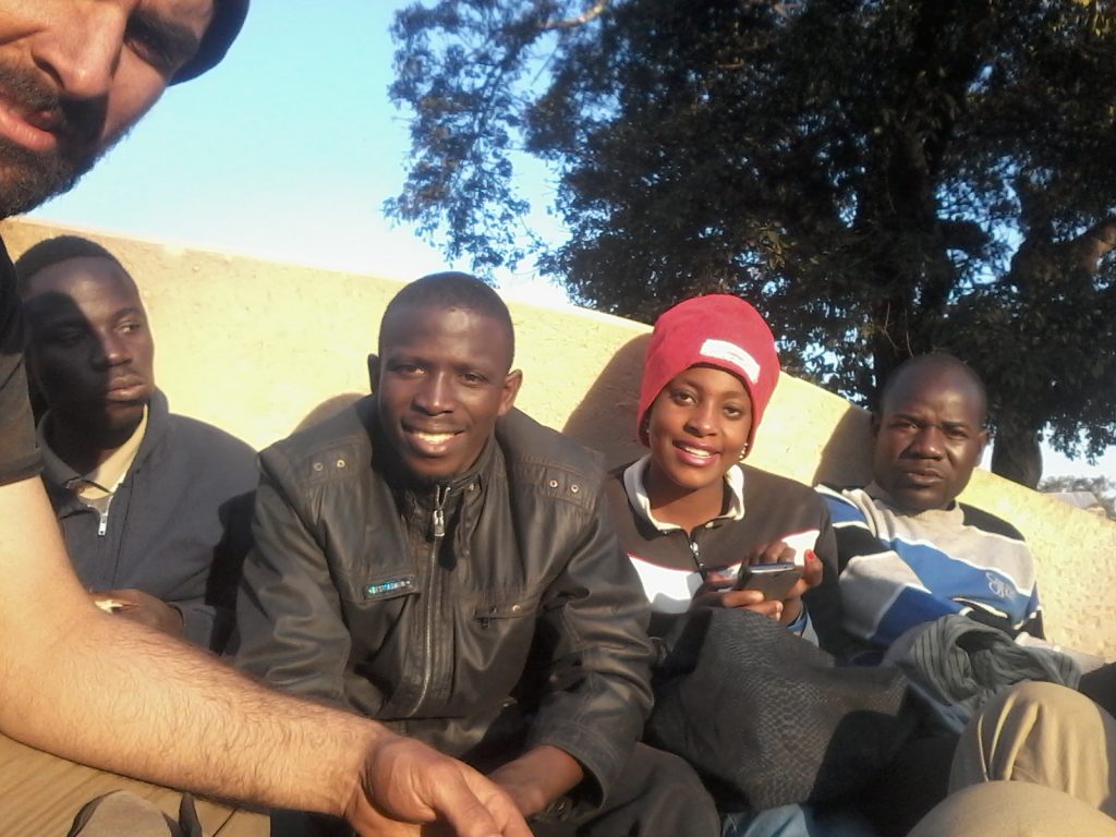 Getting dusty in the back of the truck with the survey crew.